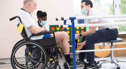 Hospital rehab for man in wheelchair