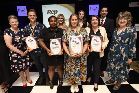 CSP representatives pose for a group photo receiving their award on stage